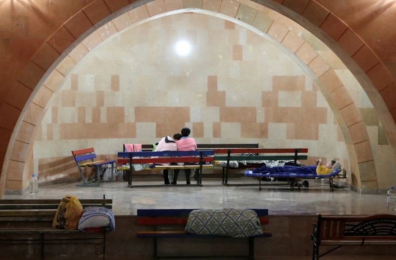 Civilians gather in the basement of a building used as a bomb shelter during a military conflict over the breakaway region of Nagorno-Karabakh in Stepanakert on September 30, 2020. (REUTERS Photo)