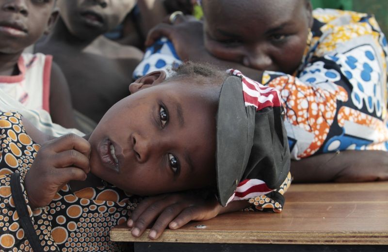A girl displaced as a result of Boko Haram attack in the northeast region of Nigeria, rests her head on a desk at Maikohi secondary school camp for internally displaced persons (IDP) in Yola, Adamawa State January 13, 2015. Boko Haram says it is building an Islamic state that will revive the glory days of northern Nigeria's medieval Muslim empires, but for those in its territory life is a litany of killings, kidnappings, hunger and economic collapse. Picture taken January 13, 2015. (REUTERS File Photo)