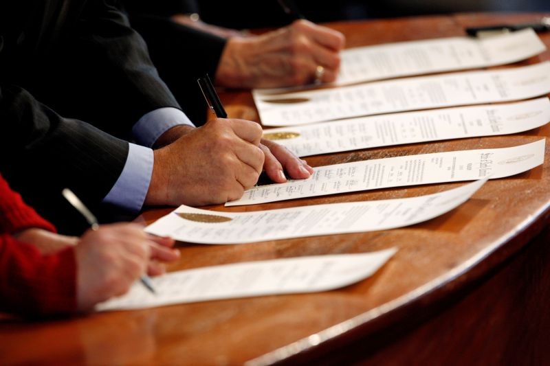 North Carolina Electoral College representatives sign the Certificates of Vote in the State Capitol building in Raleigh, North Carolina, U.S., December 19, 2016. (REUTERS File Photo)