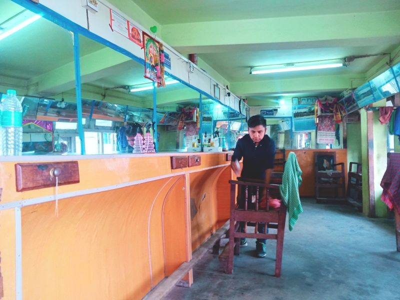 A barber sanitizes his establishment in Kohima. (Morung Photo)