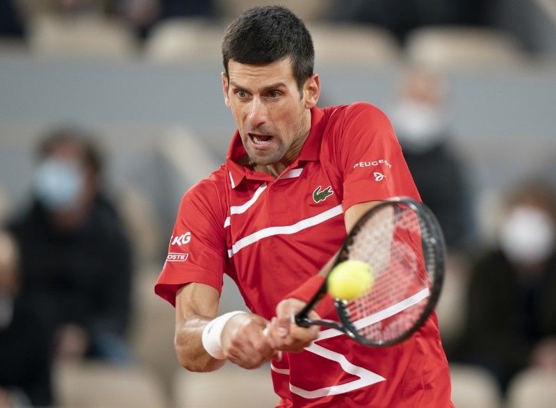 Novak Djokovic (SRB) in action during his match against Rafael Nadal (ESP) on day 15 at Stade Roland Garros. Mandatory Credit: Susan Mullane-USA TODAY Sports