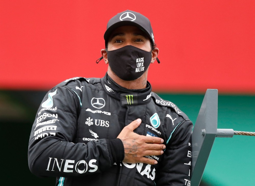 FILE PHOTO: Formula One F1 - Portuguese Grand Prix - Algarve International Circuit, Portimao, Portugal - October 25, 2020 Mercedes' Lewis Hamilton celebrates winning the race Pool via REUTERS/Rafael Marchante/File photo