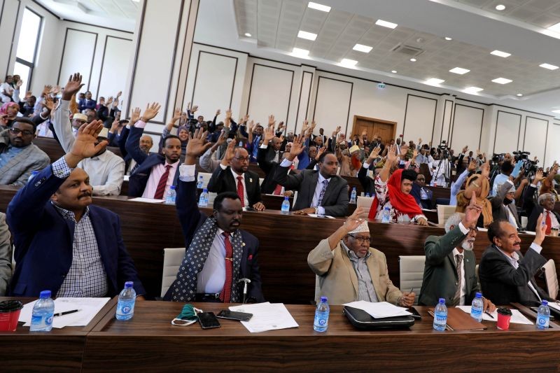Somali parliament members raise up their hands to approve the appointment of Somalia's new prime minister Mohamed Hussein Roble, in Mogadishu, Somalia September 23, 2020. (REUTERS File Photo)