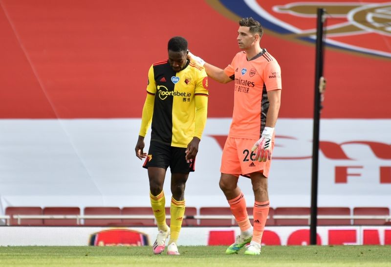 Watford's Danny Welbeck is consoled by Arsenal's Emiliano Martinez at the end of the match after Watford are relegated from the Premier League, as play resumes behind closed doors following the outbreak of the coronavirus disease (COVID-19) Pool via REUTERS/Rui Vieira