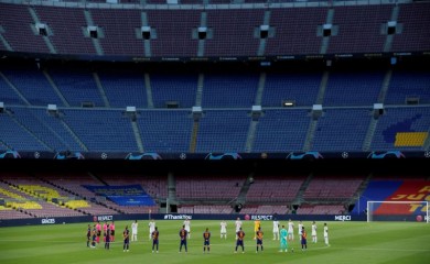 FILE PHOTO: General view during a minute's silence before the match for the victims of the coronavirus disease, as play resumes behind closed doors following the outbreak of the coronavirus disease (COVID-19) REUTERS/Albert Gea/File Photo