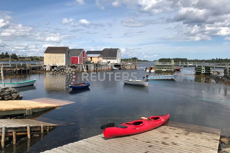 A red kayak is pictured on a dock in Blue Rocks, Nova Scotia, Canada, August 11, 2019. (REUTERS File Photo)