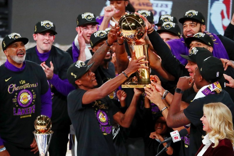 Oct 11, 2020; Lake Buena Vista, Florida, USA; The Los Angeles Lakers hold up the Finals trophy after game six of the 2020 NBA Finals at AdventHealth Arena. The Los Angeles Lakers won 106-93 to win the series. Kim Klement-USA TODAY Sports