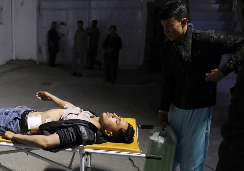 An injured man lies on a stretcher in a hospital after a suicide bombing in Kabul, Afghanistan October 24, 2020. REUTERS/Mohammad Ismail