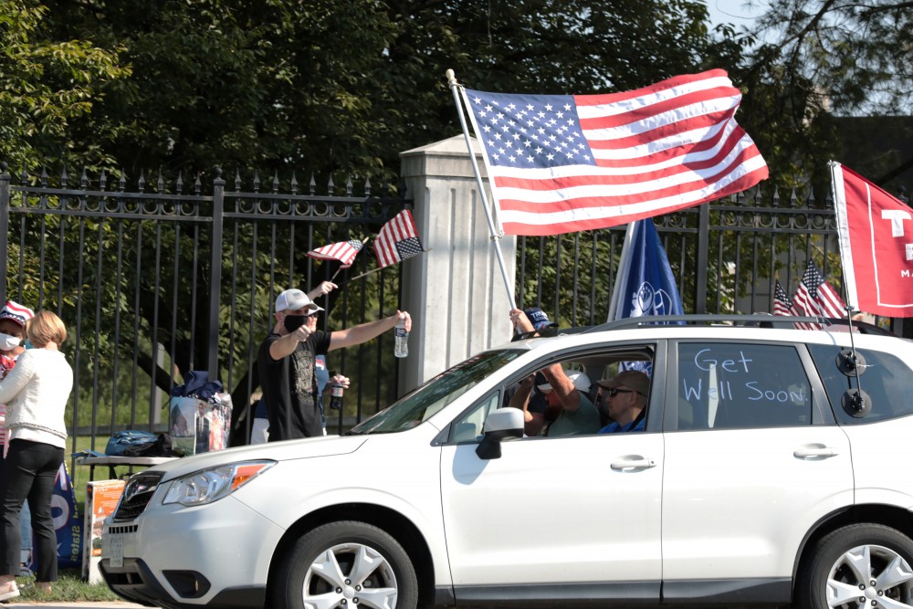 Supporters rally for U.S. President Donald Trump outside of the Walter Reed National Military Medical Center, where he is being treated for coronavirus disease (COVID-19) in Bethesda, Maryland, U.S. October 4, 2020. REUTERS/Cheriss May