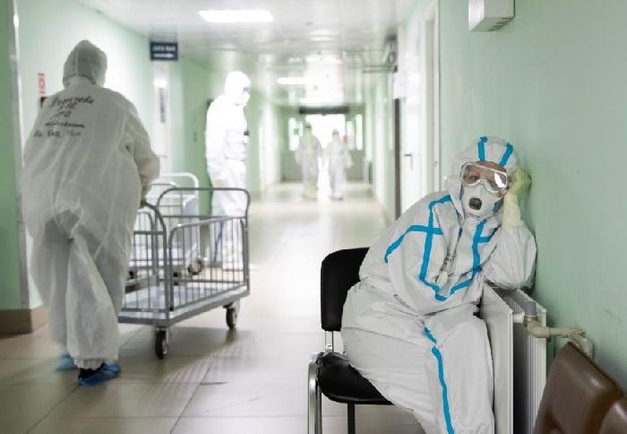 A medical specialist wearing personal protective equipment (PPE) takes a break at the City Clinical Hospital Number 15 which delivers treatment to COVID-19 patients in Moscow, Russia. REUTERS/Maxim Shemetov
