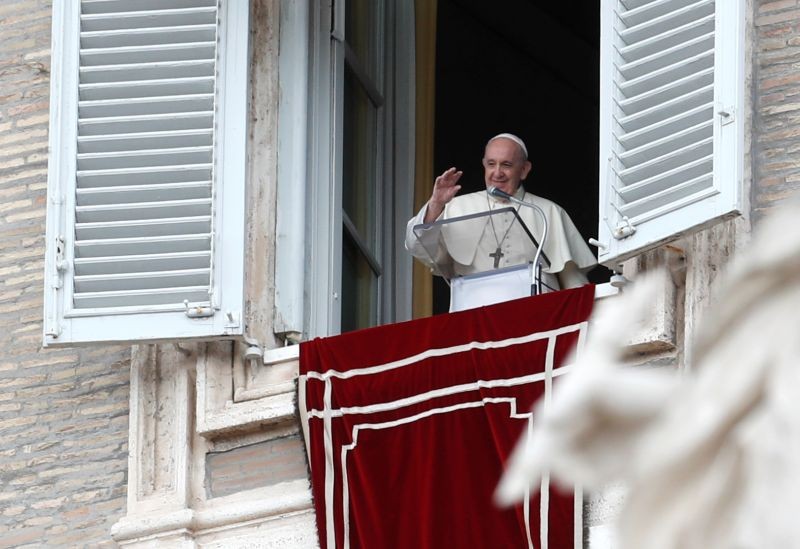 Pope Francis waves after delivering the Angelus prayer from his window on the day of the release of his new encyclical, titled "Fratelli Tutti" (Brothers All), at St. Peter's Square at the Vatican on October 4, 2020. (REUTERS Photo)