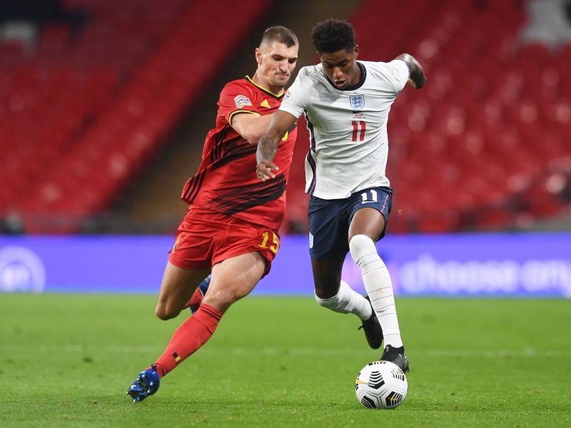 Belgium's Thomas Meunier in action with England's Marcus Rashford Pool via REUTERS/Neil Hall