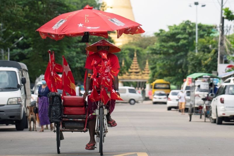 A trishaw drives by while campaigns for the National League for Democracy (NLD) party amid the coronavirus disease (COVID-19) spread, in Yangon, Myanmar on October 5, 2020. (REUTERS Photo)