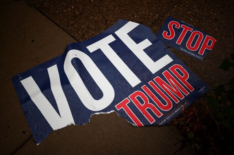 A torn voting sign lies on the pavement, in Philadelphia, Pennsylvania, U.S., October 29, 2020. (REUTERS Photo)