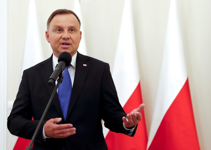 FILE PHOTO: Polish President and presidential candidate of the Law and Justice (PiS) party Andrzej Duda talks to the media after the announcement of the first exit poll results on the second round of the presidential election, at the Presidential Palace in Warsaw, Poland, July 12, 2020. REUTERS/Aleksandra Szmigiel/File Photo