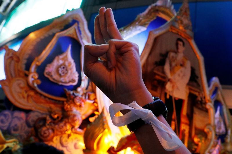 A pro-democracy protester shows the three-finger salute during an anti-government protest, in Bangkok, Thailand October 18, 2020. (REUTERS Photo)