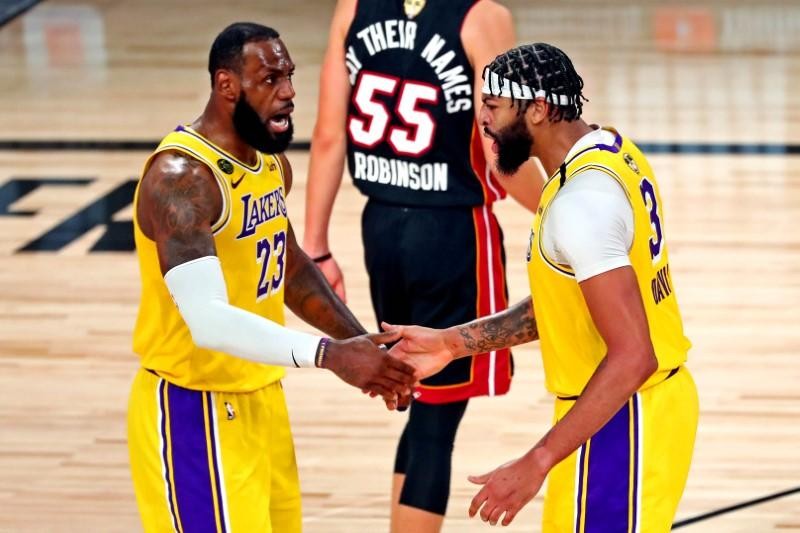 Los Angeles Lakers forward Anthony Davis (3) celebrates with forward LeBron James (23) after a play during the third quarter against the Miami Heat in game one of the 2020 NBA Finals at AdventHealth Arena. (USA TODAY Sports Photo via Reuters)