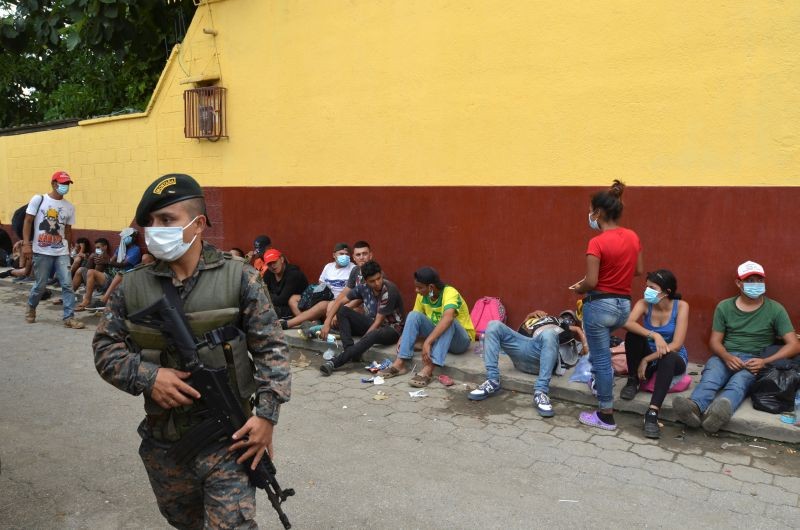 A Guatemalan soldier patrols to prevent a group of Honduran migrants who are trying to reach the U.S. , from moving towards the Guatemala and Mexico border, as they sit outside the migrant shelter, in Tecun Uman, Guatemala October 3, 2020. (REUTERS Photo)