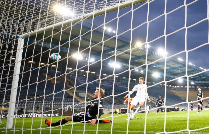 Bayern Munich's Thomas Muller scores their first goal Pool via REUTERS/Wolfgang Rattay