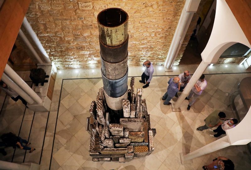 Visitors look at an artwork by Alfred Tarazi during a collective exhibition entitled "Beirut Year Zero", in which some of the proceeds will be donated to the Lebanese Red Cross, who will support families affected by the port explosion, at Arthaus Beirut, Lebanon on October 2, 2020. (REUTERS Photo)