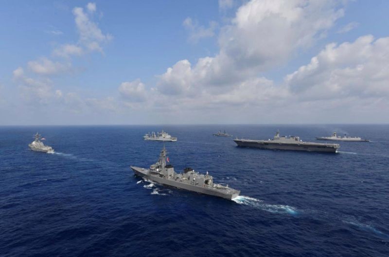 FILE PHOTO: Vessels from the U.S. Navy, Indian Navy, Japan Maritime Self-Defense Force and the Philippine Navy sail in formation at sea, in this recent taken handout photo released by Japan Maritime Self-Defense Force on May 9, 2019. Japan Maritime Self-Defense Force/Handout via REUTERS/File Photo