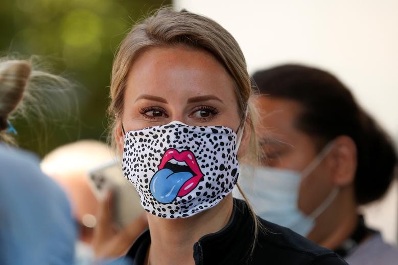 A nurse at St. Joseph's Hospital wears a unique mask as the hospital celebrates the release of a COVID-19 patient after 45 days in their care in Orange, California, May 5, 2020. REUTERS/Mike Blake