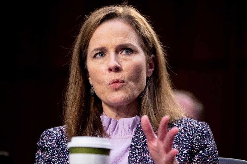 Judge Amy Coney Barrett responds to a question from Democratic vice presidential candidate Senator Kamala Harris (D-CA) during the third day of her Senate confirmation hearing to the Supreme Court on Capitol Hill in Washington, DC, U.S., October 14, 2020. Michael Reynolds/Pool via REUTERS/File Photo