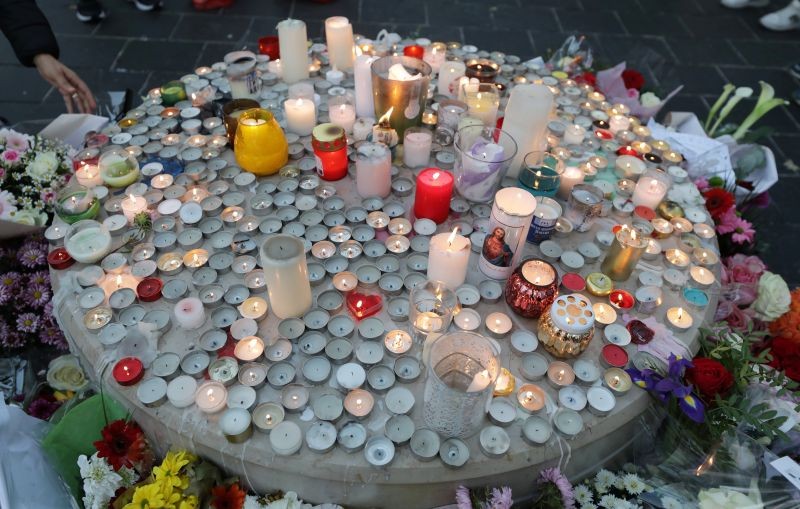 Candles and flowers are seen near the Notre Dame church in tribute to the victims of a deadly knife attack in Nice, France, October 30, 2020. REUTERS/Eric Gaillard