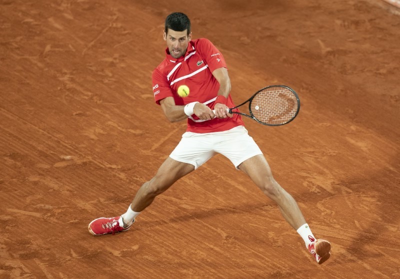 Novak Djokovic (SRB) in action during his match against Stefanos Tsitsipas (GRE) on day 13 at Stade Roland Garros. Mandatory Credit: Susan Mullane-USA TODAY Sports