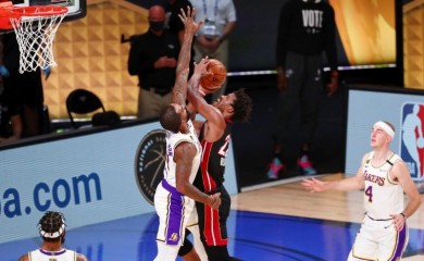 Miami Heat forward Jimmy Butler (22) shoots over Los Angeles Lakers guard JR Smith (21) during the second quarter of game three of the 2020 NBA Finals at AdventHealth Arena. (USA TODAY Sports Photo via Reuters)