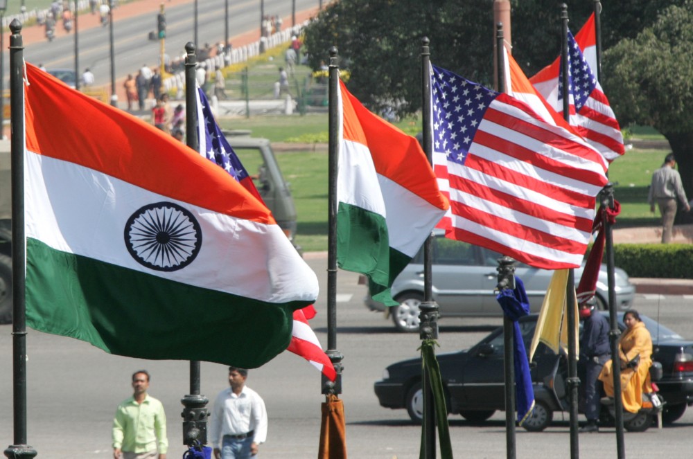 Indian and U.S. national flags flutter in New Delhi February 28, 2006. REUTERS/B Mathur/File Photo