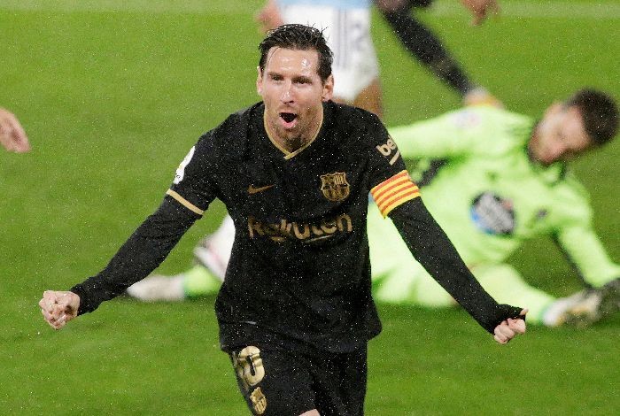 Soccer Football - La Liga Santander - Celta Vigo v FC Barcelona - Estadio de Balaidos, Vigo, Spain - October 1, 2020. Barcelonaâ€™s Lionel Messi speaks celebrates their second goal. REUTERS/Miguel Vidal