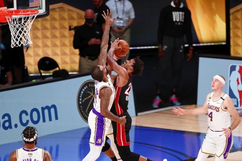 Miami Heat forward Jimmy Butler (22) shoots over Los Angeles Lakers guard JR Smith (21) during the second quarter of game three of the 2020 NBA Finals at AdventHealth Arena. (USA TODAY Sports Photo via Reuters)