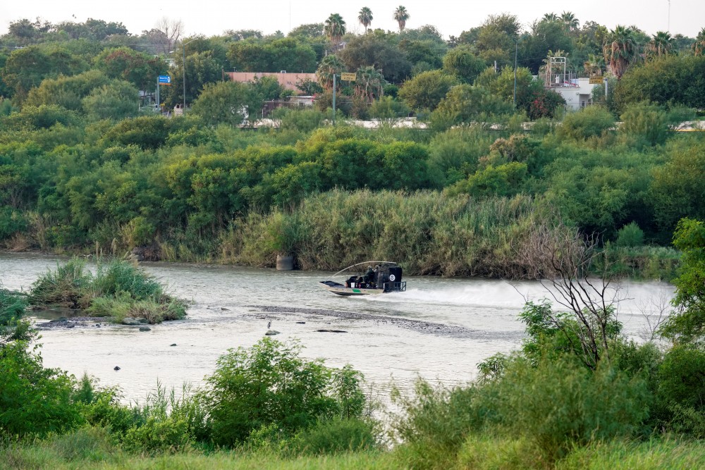 LAREDO, Texas - Former U.S. Border Patrol agent Daniel Perales spent hours over the years crouched at the mouth of the Zacata Creek, a tributary of the Rio Grande, listening for the snap of carrizo cane as border crossers from Mexico arrived on the northern banks.  These days, he listens for the whistle of the Morelet's seedeater, a bird rare in these parts, and frets about the proposed construction of a border wall here.  "It would fragment the habitat of the birds, especially those that live along the river," said Perales, who spent nearly 30 years with the federal agency and oversaw 400 agents at the Laredo North Station before retiring in 2007.  Perales said he voted for President Donald Trump in 2016 and plans to do so again. But that hasn't stopped him from joining the ranks of residents in Laredo opposed to building a barrier here as part of Trump's promised wall spanning the U.S.-Mexico border.  "It's not necessary. You don't need a wall here," said Perales, adding that cameras and patrol roads were sufficient.  Less than a month before the U.S. presidential election, resistance to the wall, a centerpiece of Trump's 2016 campaign, is flaring across parts of the approximately 2,000-mile border. Near construction sites in Arizona and California in recent weeks, members of Native American tribes have clashed with law enforcement and others over plans for building on lands the tribes consider sacred. Two weeks ago in front of a Laredo courthouse, military veterans against the border project mobilized to thwart a caravan of Trump supporters who had sought to drive over a 30-foot "Defund the Wall" street mural.  Amid an election upended by Trump's positive coronavirus diagnosis, the future of the wall hangs in the balance. Trump's Democratic challenger, former vice president Joe Biden, has said he would not build "another foot of wall" if elected.  Meanwhile, opposition to plans for a stretch of wall in the counties of Zapata and Webb, which includes Laredo, has united some strange bedfellows: the street artists, multimillionaire Republicans, Catholic nuns, military and border patrol veterans, conservationists and a local Native American tribe.  In Webb County, CBP has issued contracts worth $1.05 billion to three construction companies to build approximately 69 miles of a 30-foot steel bollard wall, as well as construct roads and adding cameras and other surveillance technology.  Construction is slated to begin as early as January depending on the availability of land.  In an August press release, CBP officials said the Laredo wall is necessary to "impede and deny illegal border crossings and the drug and human smuggling activities of transnational criminal organizations." In the Laredo sector, traffic has not abated during the coronavirus pandemic as it has in other sectors, government data show.  In statements to Reuters, CBP spokesman Matthew Dyman said the agency is committed to protecting cultural and natural resources, such as wildlife corridors and culturally sensitive Native American artifacts or sites.  The agency is now surveying land for possible purchase. Dyman said it is "always CBP's preference" to obtain land voluntarily through negotiated offers but if that is not possible, a condemnation action - known as eminent domain - may be required.  The majority of Americans oppose a substantial expansion of the border wall, according to a January 2019 Pew research poll, although the opinions tended to fall along party lines, with 82% of Republicans in favor and 93% of Democrats opposed.  Opposition in Laredo, which is predominantly Democrat but contains a substantial Republican contingent, appears more lopsided. More than two dozen cities, counties, and Native American tribes in the border region have passed resolutions opposing the project, including Laredo in 2017.  DECLARING INDEPENDENCE - AGAIN  A city of 262,000, Laredo sits in a former Spanish colony and Mexican territory, hugging the Rio Grande River. Here, partisan political divisions quickly evaporate when it comes to deciding on boundaries and the fate of the land.  Webb County is 95% Hispanic and many residents have family connections to Mexico. Business owners depend on cross-border trade. Some ranchers trace their property rights back to the 18th century Spanish land grants. The ancestors of the Carrizo/Comecrudo Tribe of Texas formed their ties to the territory well before then.  In 1840, Laredo was the seat of the short-lived Republic of the Rio Grande, whose independence from Mexico lasted for 10 months before its cavalry was crushed by that country's Army.  "We've declared independence before — and we could do it again," said Margarita Araiza, executive director of the Webb County Heritage Foundation who traces her family's roots in Laredo back twelve generations to that 19th-century rebellion.  She worried the wall's construction could destroy or destabilize the city's 250-year-old historic sandstone buildings and sever its cozy relationship to the Rio Grande, where residents often fish, picnic, and stroll.  "This is the reason this city was created, because of access to the river," said Araiza.  CBP spokesman Dyman said that no historic buildings would be directly affected by border wall construction based on current plans.  Araiza is one of the founding members of the Laredo No Border Wall Coalition, a loosely organized group that seeks to halt the project.  Working with a coalition of concerned landowners is the Laredo-based IBC Bank, whose chief executive officer, Dennis Nixon, was a top Trump donor in 2016. The proposed barrier could cut through the bank's 75 acres of waterfront property.  "At a time when (America’s) number one trading partner is Mexico, what is the message we are sending to our friends in Mexico?" said Gerardo Schwebel, executive vice president of the bank's corporate international division.  Not everyone in the city is opposed to the barrier. Supporters say the Mexican town of Nuevo Laredo, just across the river, is a hub for drug trafficking and human smuggling.  "No one wants to build a wall around their homes if they don't have to, but there's a need for that security," said Hector Garza, president of the National Border Patrol Council's local union chapter.  ‘A BETTER WAY’?  The proposed border wall in Texas primarily cuts through private land, generating opposition and some alliances among occupants and landowners large and small.  Felipe Antonio Perez, a 92-year-old retired carpenter, said he'd lived in his modest wooden house near the river bank in Laredo's historic La Azteca neighborhood for over sixty years. Standing beside a "No Border Wall" sign on his fence, he told Reuters he'd thrown away a government inquiry about surveying his land.  The oil-rich Fasken family, one of the top-fifty largest landowners in the United States with 85,000 acres in Webb County alone, co-founded the Rio Grande Landowners' Coalition to stop the wall project.  "We feel there is a better way to secure the border and that putting up a 30-foot high wall to make a political statement is not the best use of taxpayers' money," said Bill Skeen, the family's real estate manager.  Also opposed are the sisters of the century-old Sacred Heart Children's Home for orphans, which overlooks the river.  "Put yourself in the place of an individual who has been orphaned - abandoned, abused, or whose parents have died -- the land and its natural beauty and its view becomes your refuge," said Beto Cardenas, the attorney representing the sisters in their negotiations with the government.  The ancestral territory of the Carrizo/Comecrudo Tribe of Texas extends on both sides of the river, said Chairman Juan Mancias as he surveyed riverside willow trees that the tribe uses to build sweat lodges on ranch land outside Laredo. Native burial grounds lie along the river, he said.  "The wall is a racial attack on our identity as people of the land," he said.  He said the tribe does not own riverfront land - it "owns us." But his people are committed to protecting it.  "My great grandchildren would be denied this," he said, looking across the landscape dotted with mesquite trees and purple sage. "They would be denied who they are."