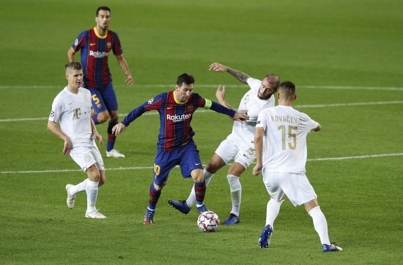 Soccer Football - Champions League - Group G - FC Barcelona v Ferencvaros - Camp Nou, Barcelona, Spain - October 20, 2020 FC Barcelona's Lionel Messi in action with Ferencvaros' Miha Blazic REUTERS/Albert Gea
