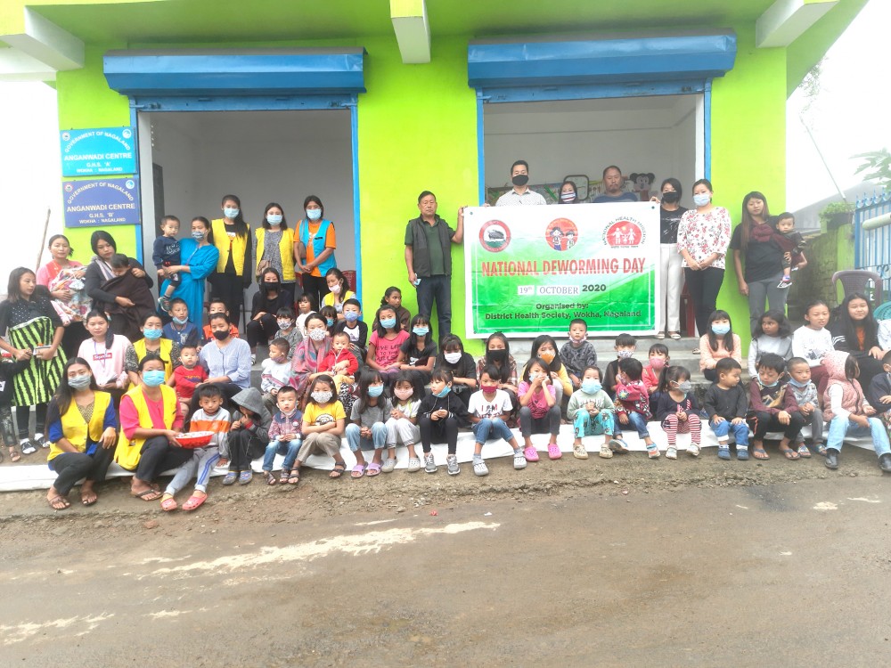 Medical Officer Dr Kuokholie Savino, Mhonbeni Ezung DPM along with ASHAs, anganwadi workers and beneficiaries at GHSS Anganwadi Centre Wokha Town.