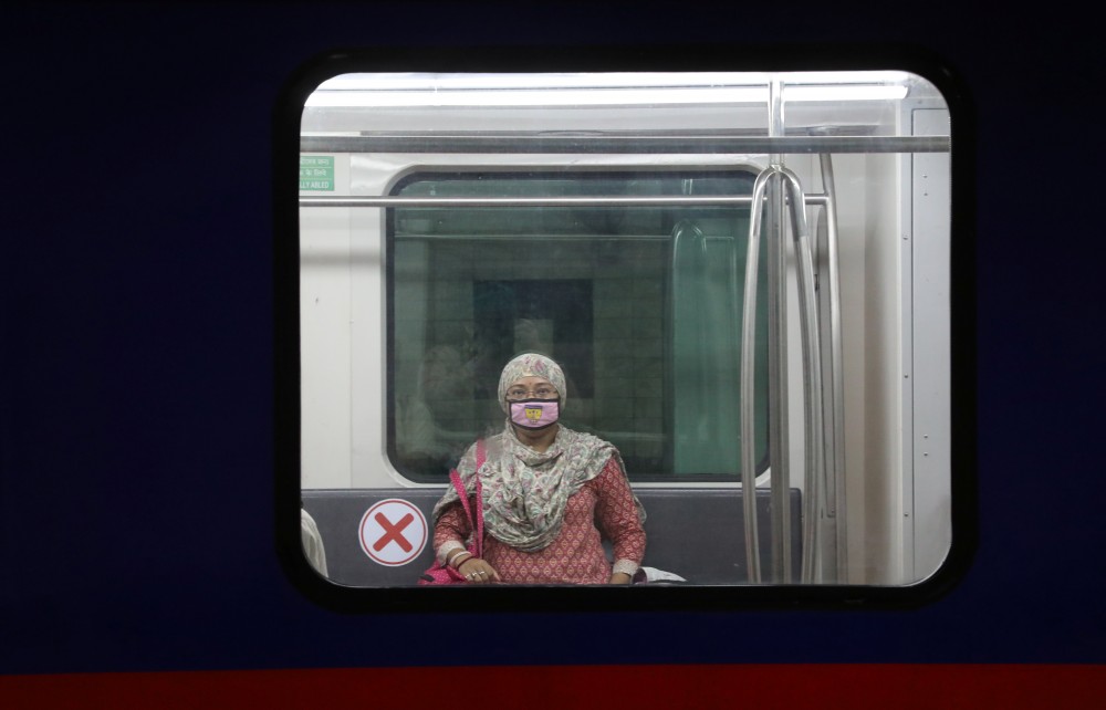A staff member wearing a protective mask travels inside a metro train during its trial run ahead of the restart of its operation, amidst the COVID-19 spread in Kolkata, India, September 9, 2020. REUTERS/Rupak De Chowdhuri