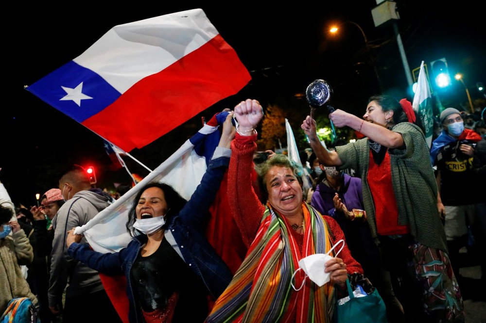 Supporters of the "I Approve" option react after hearing the results of the referendum on a new Chilean constitution in Valparaiso, Chile, October 25, 2020. REUTERS/Rodrigo Garrido