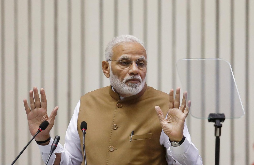 FILE PHOTO: India's Prime Minister Narendra Modi gestures as he addresses the gathering during the 'Global Mobility Summit' in New Delhi, India, September 7, 2018. REUTERS/Adnan Abidi/File Photo