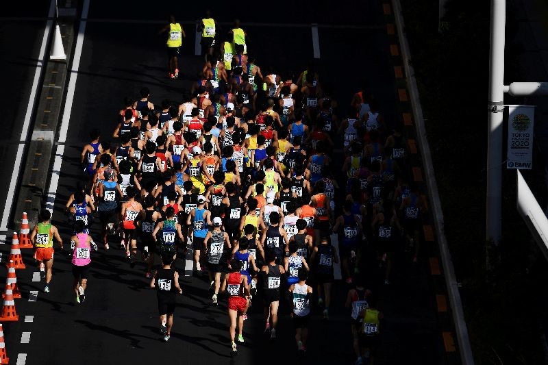 Runners compete in the Tokyo Marathon in Tokyo, Japan, March 1, 2020.  Charly Triballeau/Pool via REUTERS/Files