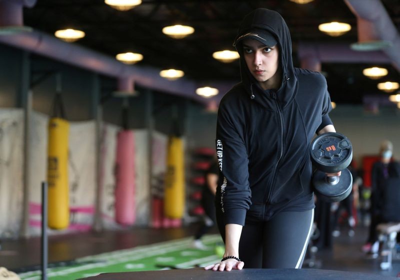 The price of membership to fitness clubs in the Kingdom range approximately from SR900 ($240) to SR4,000 per month. It varies from gym to gym, according to the package. Above, a Saudi woman, Fayrouz Al-Omari, works out at a gym. Image Credit: REUTERS