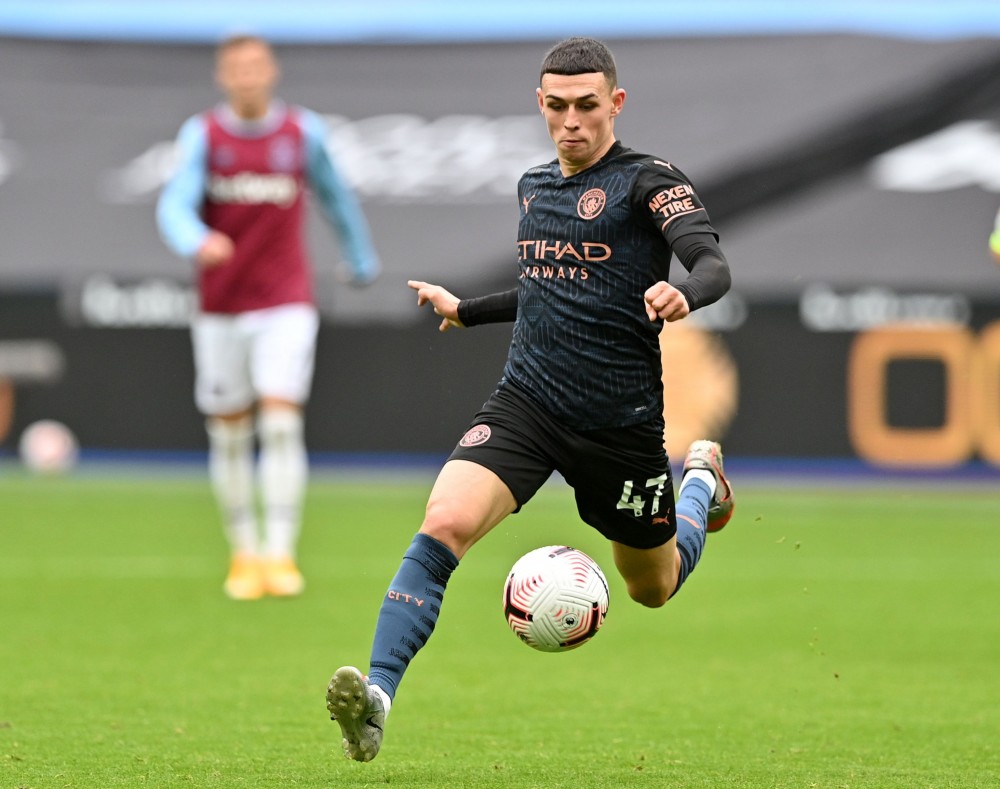 Soccer Football - Premier League - West Ham United v Manchester City - London Stadium, London, Britain - October 24, 2020 Manchester City's Phil Foden in action Pool via REUTERS/Justin Tallis