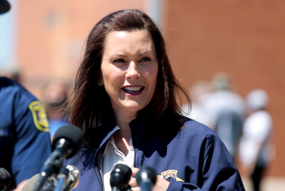 Michigan Governor Gretchen Whitmer addresses the media about the flooding along the Tittabawassee River, after several dams breached, in downtown Midland, Michigan, U.S., May 20, 2020. REUTERS/Rebecca Cook/File Photo