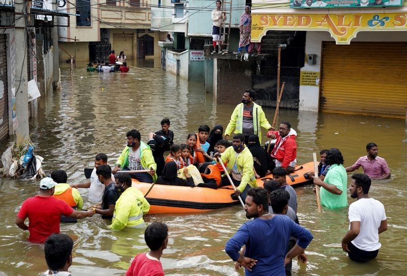 Residents are evacuated from a flooded neighbourhood after heavy rainfall in Hyderabad, the capital of the southern state of Telangana, October 15, 2020. REUTERS/Vinod Babu