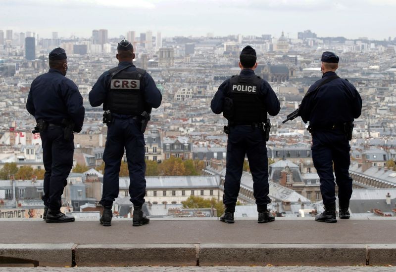 French police and CRS riot policemen patrol in Montmartre in Paris as France has raised the security alert for French territory to the highest level after the knife attack in the city of Nice, France, October 30, 2020. REUTERS/Charles Platiau