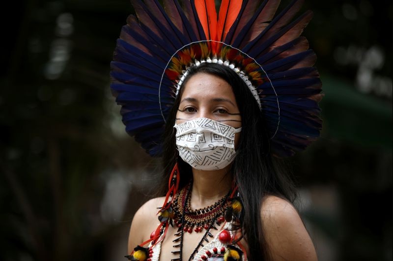 Samela Satere-Mawe, a 24-year-old biology student and Indigenous activist poses for pictures near her home, which is also the headquarters of the Satere Mawe Women's Association in the Compensa neighborhood in Manaus, Amazonas state, Brazil on October 1, 2020. (REUTERS File Photo)