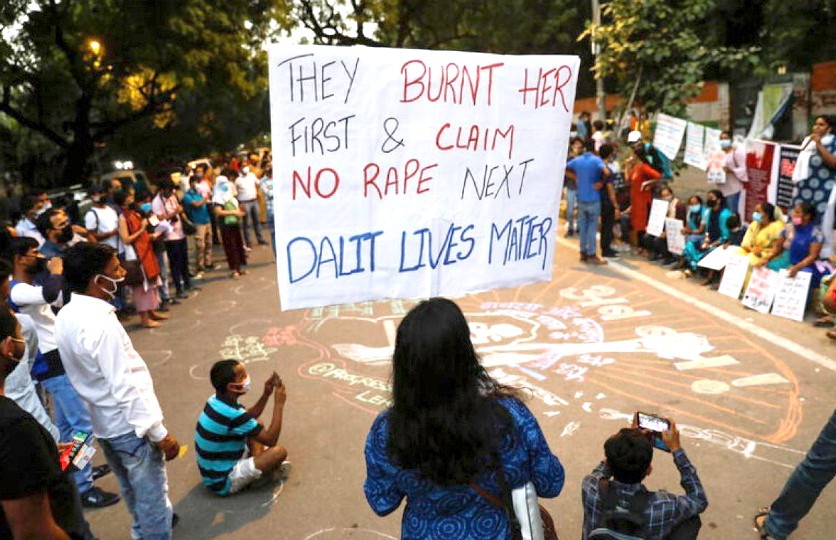 Demonstrators hold placards as they take part in a protest after the death of a rape victim, in New Delhi, India, October 4, 2020. (REUTERS)