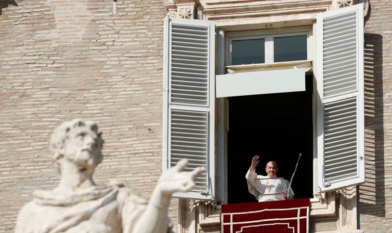 Pope Francis waves his hand during the Angelus prayer held from a window at Saint Peter's Square, Vatican, October 25, 2020. (REUTERS Photo)