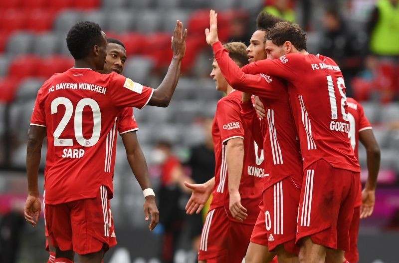 Bayern Munich's Leroy Sane celebrates scoring their fourth goal with teammates Pool via REUTERS/Christof Stache