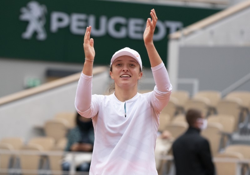 Oct 8, 2020; Paris, France; Iga Swiatek (POL) celebrates match point during her match against Nadia Podoroska (ARG) on day 12 at Stade Roland Garros. Susan Mullane-USA TODAY Sports